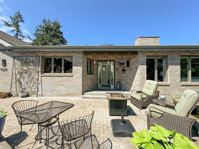 view of patio / terrace featuring a fire pit