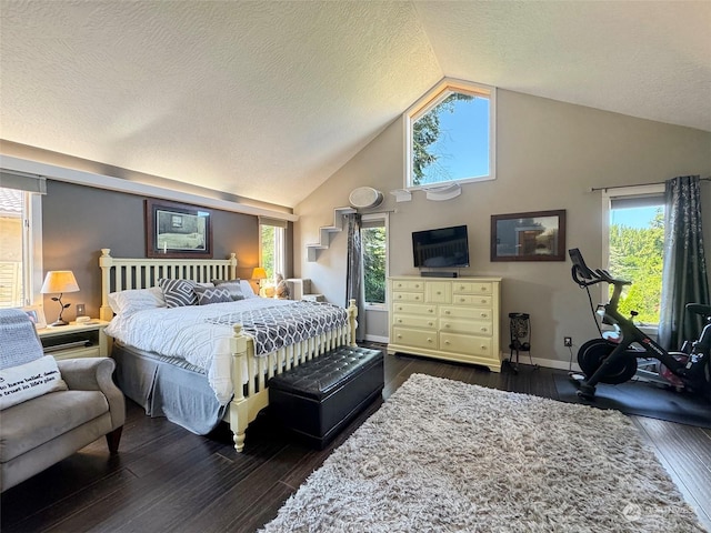 bedroom with dark wood finished floors, multiple windows, and baseboards