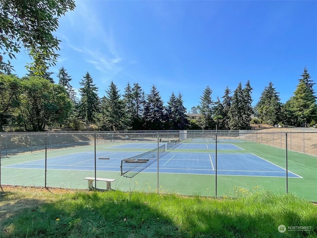 view of sport court with fence