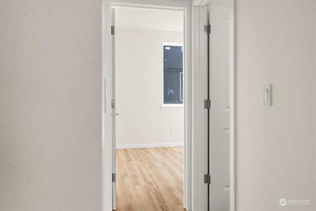 hall with light wood-type flooring