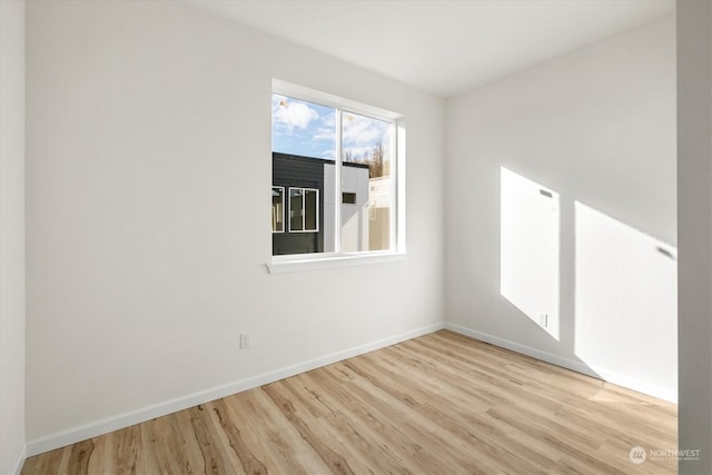 spare room featuring light hardwood / wood-style flooring