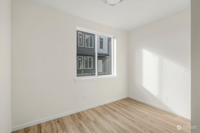 unfurnished room with light hardwood / wood-style flooring