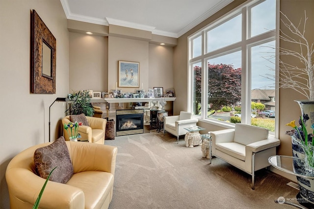 sitting room with carpet, plenty of natural light, and ornamental molding