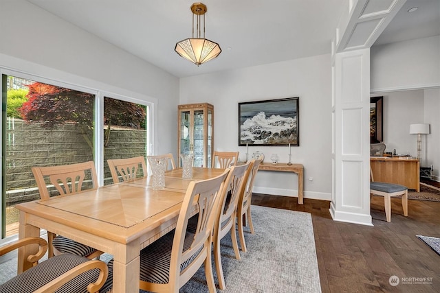 dining area featuring dark hardwood / wood-style flooring