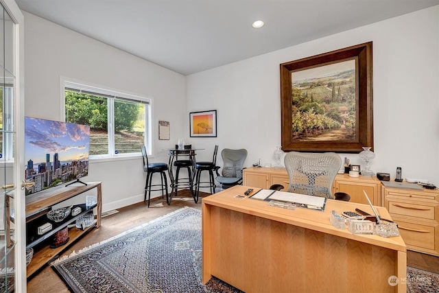 office with hardwood / wood-style flooring