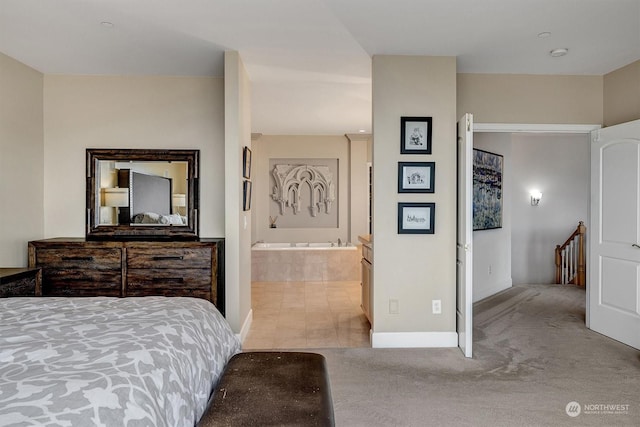 carpeted bedroom with connected bathroom