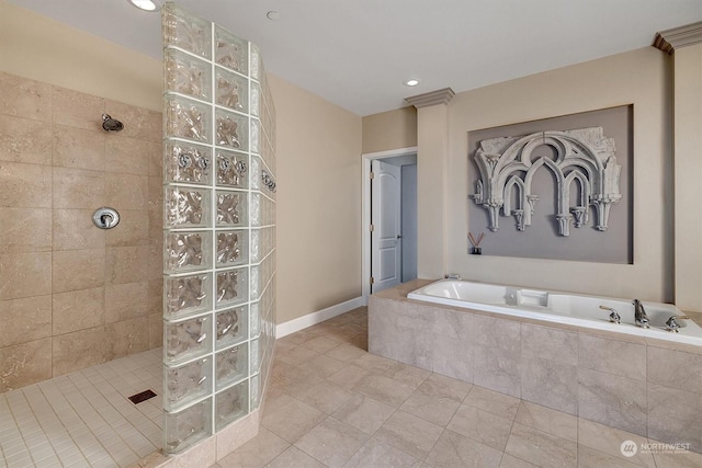 bathroom featuring independent shower and bath