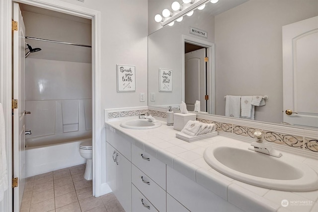 full bathroom with tile patterned floors, vanity, toilet, and tub / shower combination