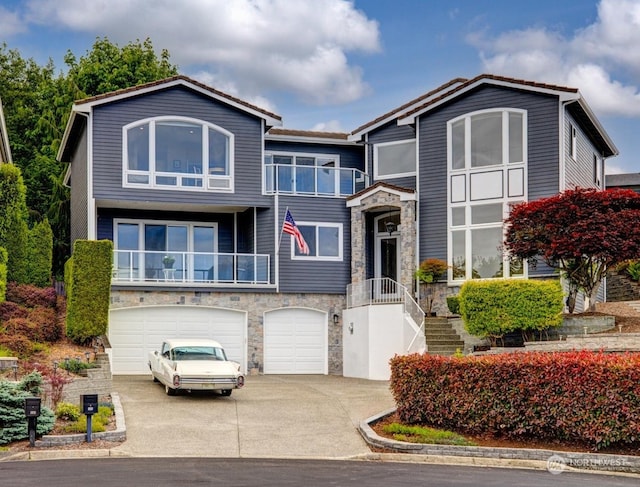 view of front facade with a balcony and a garage