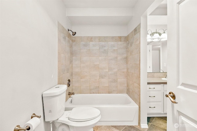 full bathroom featuring tile patterned floors, vanity, toilet, and tiled shower / bath combo