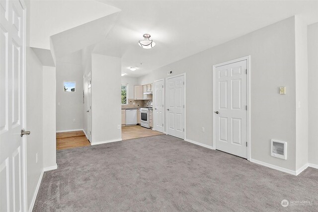 interior space with light colored carpet