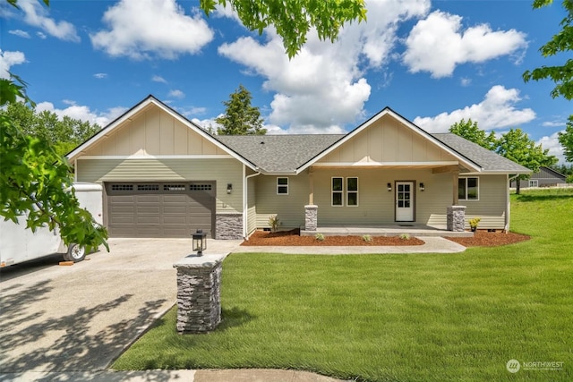 view of front facade with a porch, a garage, and a front yard