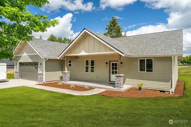 view of front facade with a front yard, a porch, and a garage