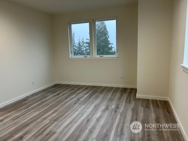 spare room featuring light hardwood / wood-style flooring