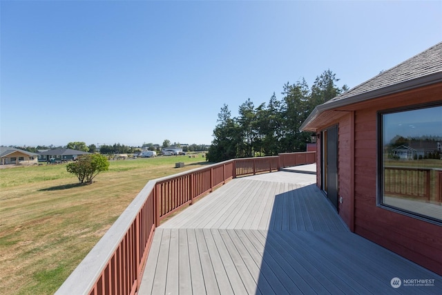 wooden terrace with a yard