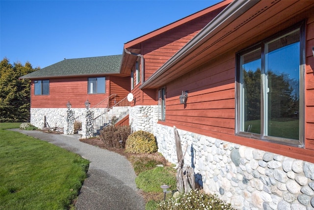 view of home's exterior featuring a yard