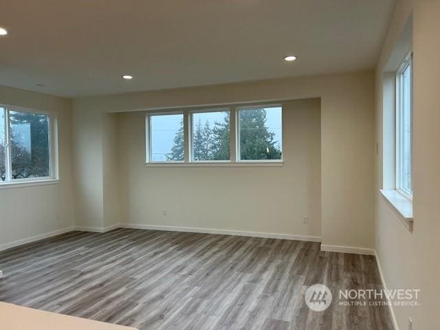 spare room featuring light hardwood / wood-style floors