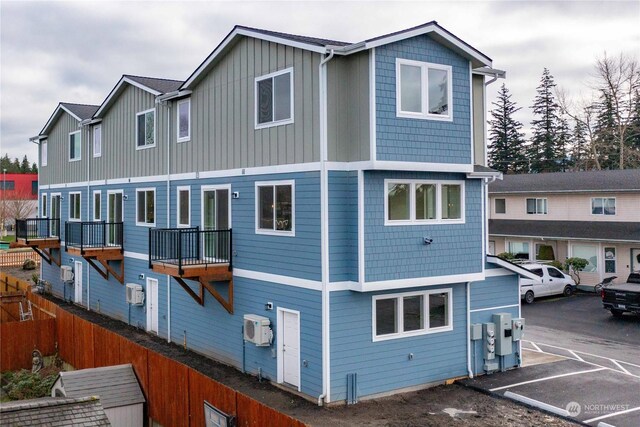 exterior space featuring a wall mounted air conditioner