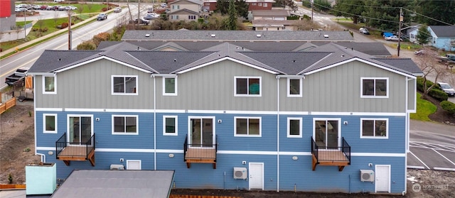 rear view of property featuring ac unit