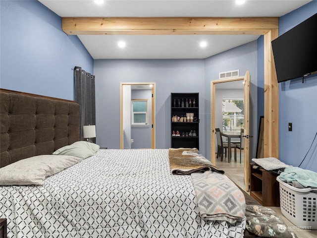 bedroom with beam ceiling