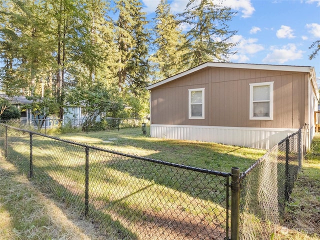 view of side of property featuring a yard