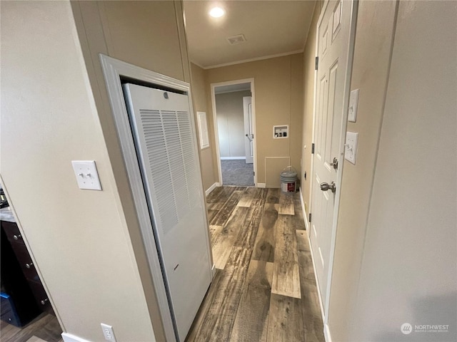 hall with crown molding and dark wood-type flooring