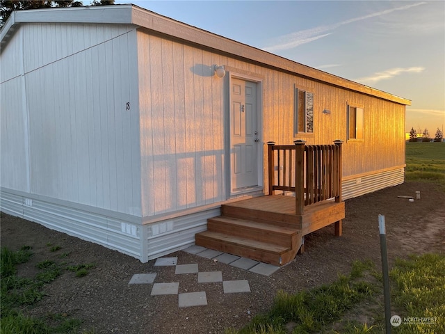 view of back house at dusk