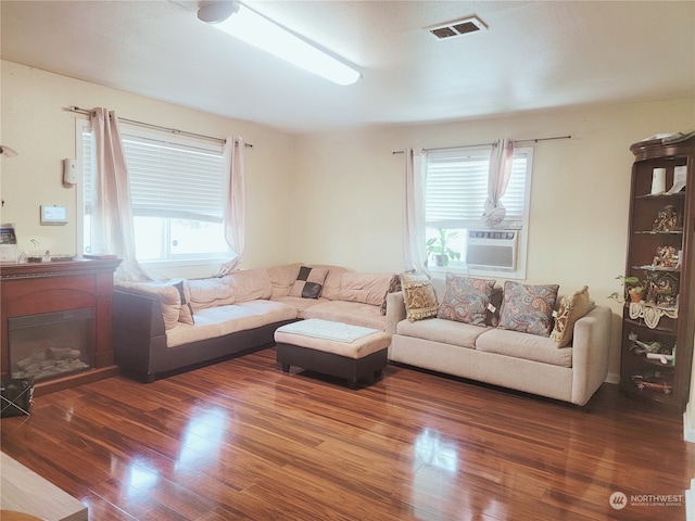 living room featuring dark wood-type flooring and cooling unit