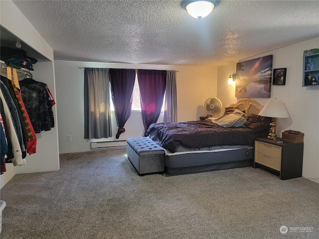 carpeted bedroom with a baseboard radiator and a textured ceiling