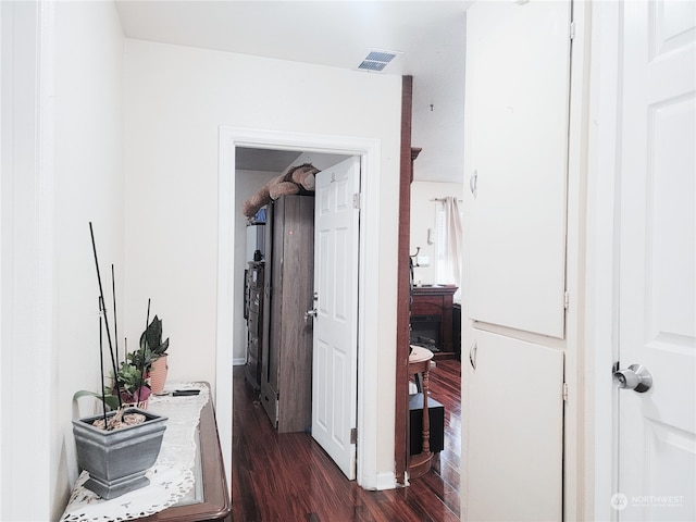 hallway with dark hardwood / wood-style floors