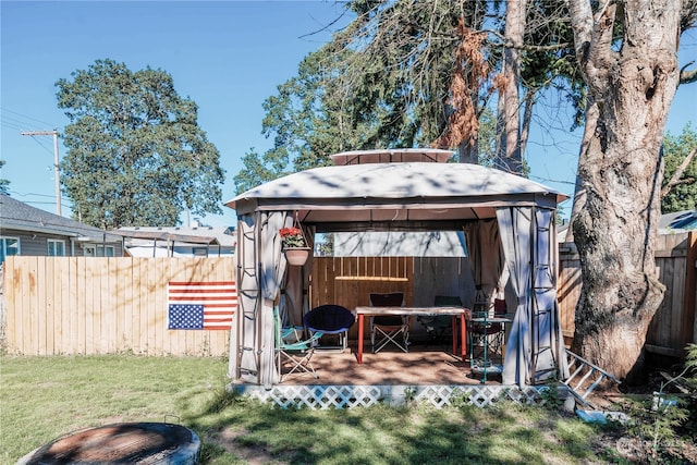 view of outbuilding featuring a gazebo and a lawn