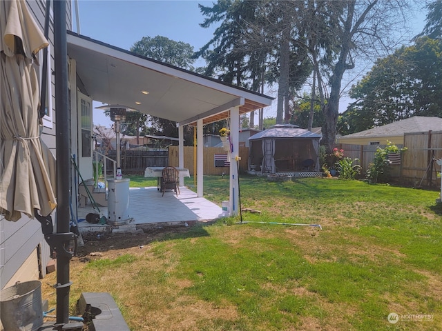 view of yard featuring a gazebo and a patio area