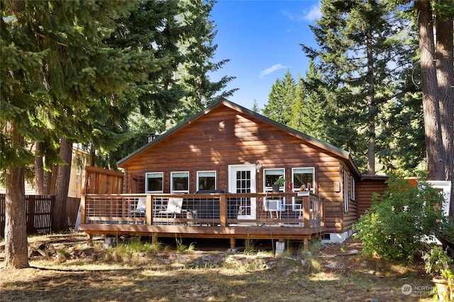 back of house featuring a wooden deck