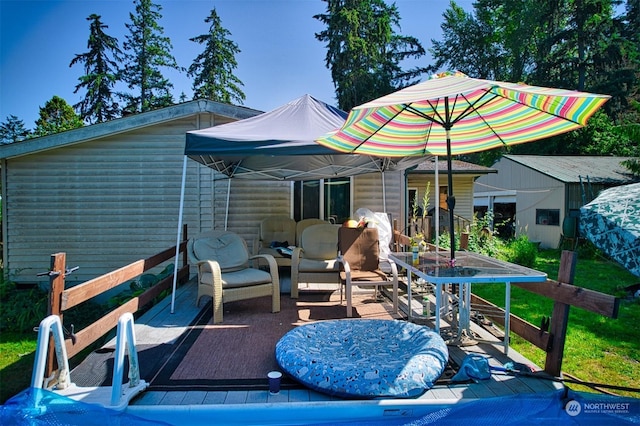 rear view of property featuring a deck