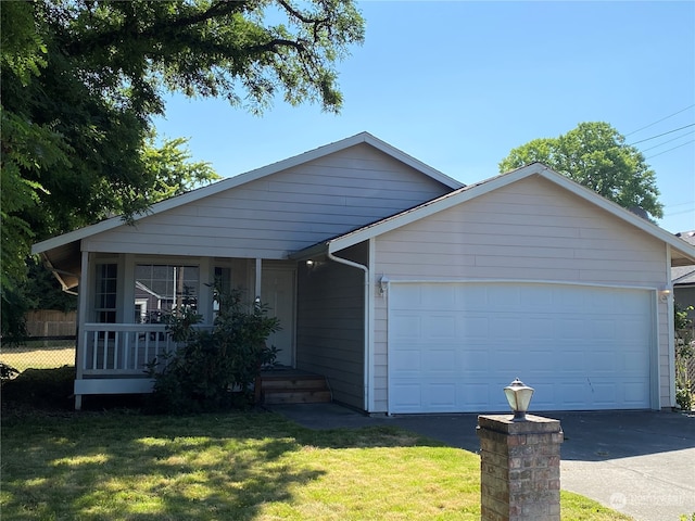 view of front facade with a garage and a front yard