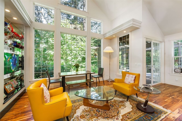 sunroom / solarium with lofted ceiling and a healthy amount of sunlight