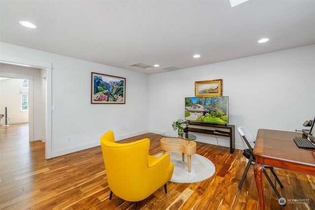 interior space with recessed lighting, visible vents, baseboards, and wood finished floors