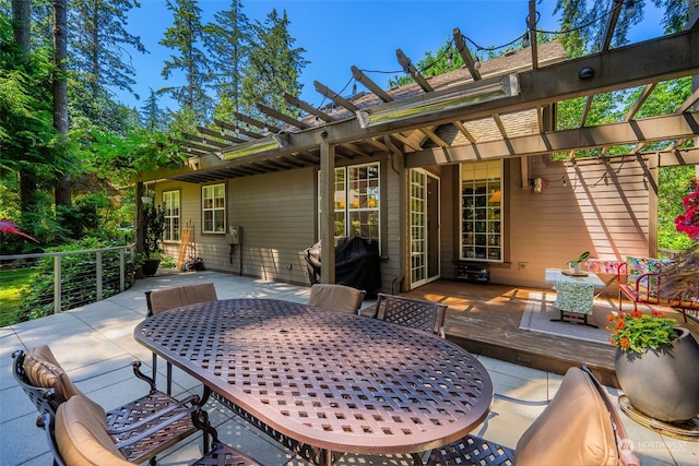 view of patio with outdoor dining area, grilling area, and a pergola