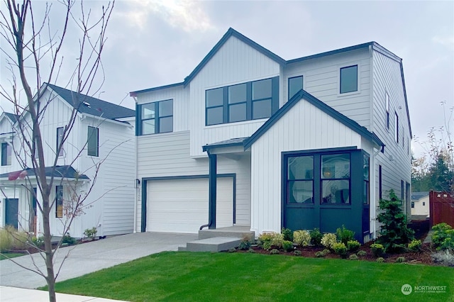 view of front of house featuring a front yard and a garage