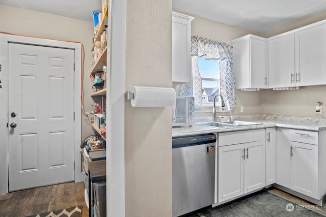 kitchen featuring sink, dark hardwood / wood-style flooring, dishwasher, and white cabinets