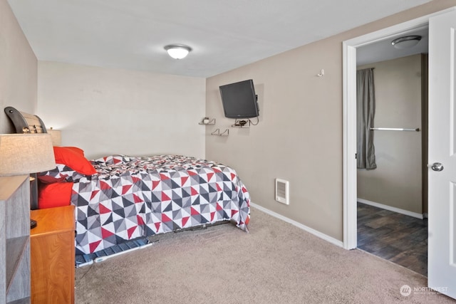 bedroom with dark wood-type flooring