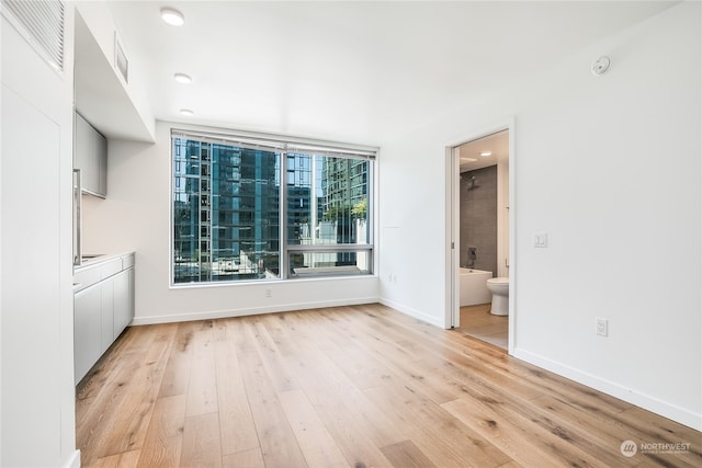 unfurnished dining area featuring light hardwood / wood-style floors