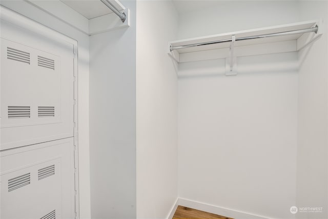 walk in closet featuring hardwood / wood-style floors