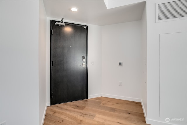 foyer with light wood-type flooring