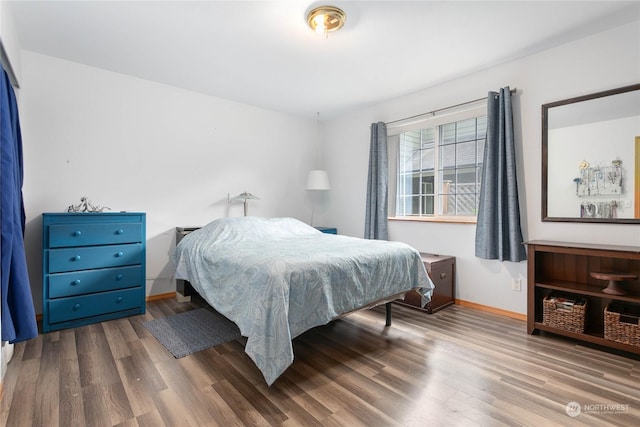 bedroom with light wood-type flooring