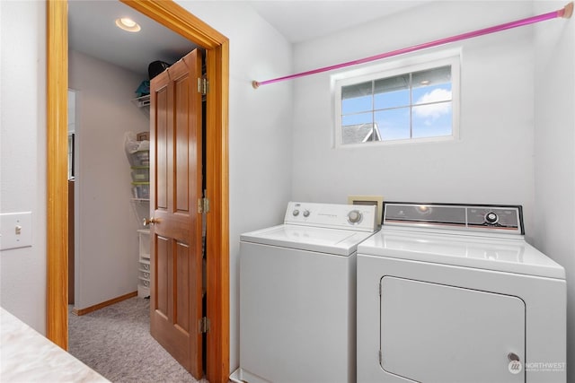 laundry area featuring carpet flooring and washing machine and dryer