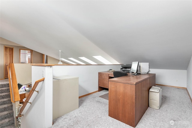 office featuring vaulted ceiling and light carpet