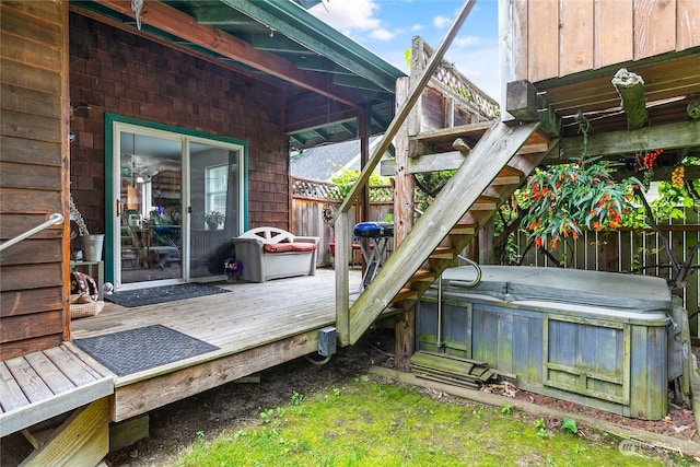 wooden terrace with a hot tub