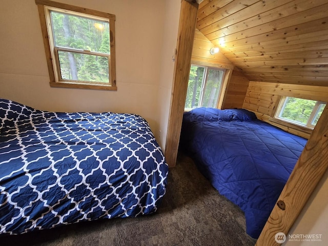 291 Spoke Ln, Cle Elum, WA 98922 - carpeted bedroom with lofted ceiling and wooden walls