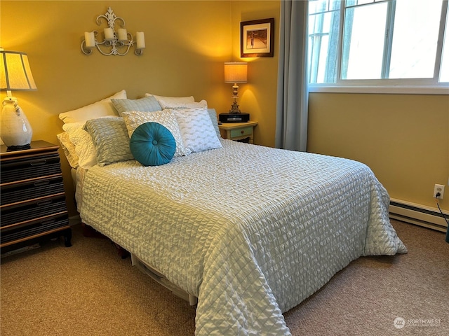 carpeted bedroom featuring baseboard heating and a notable chandelier